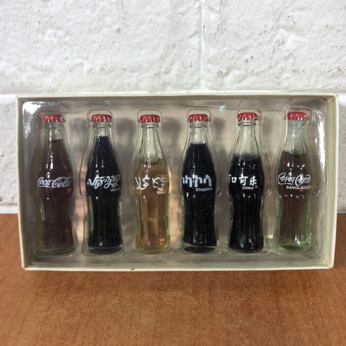 Lot 178: Coca Cola 'In The World' Miniature Glass Bottle Set