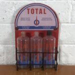 Vintage Total Glass Bottles in Modern Display Stand